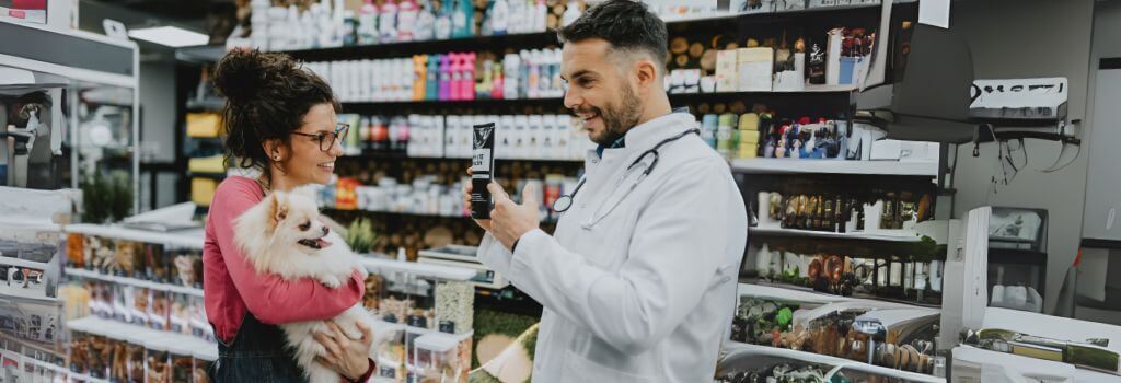 A pet owner shopping at a veterinary pharmacy